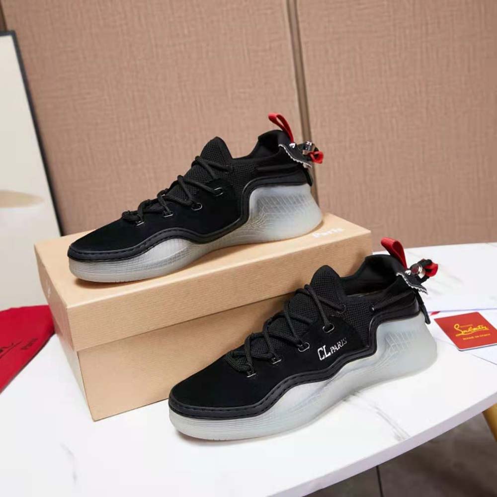 Top-down view of laces and signature red sole on Christian Louboutin sneakers