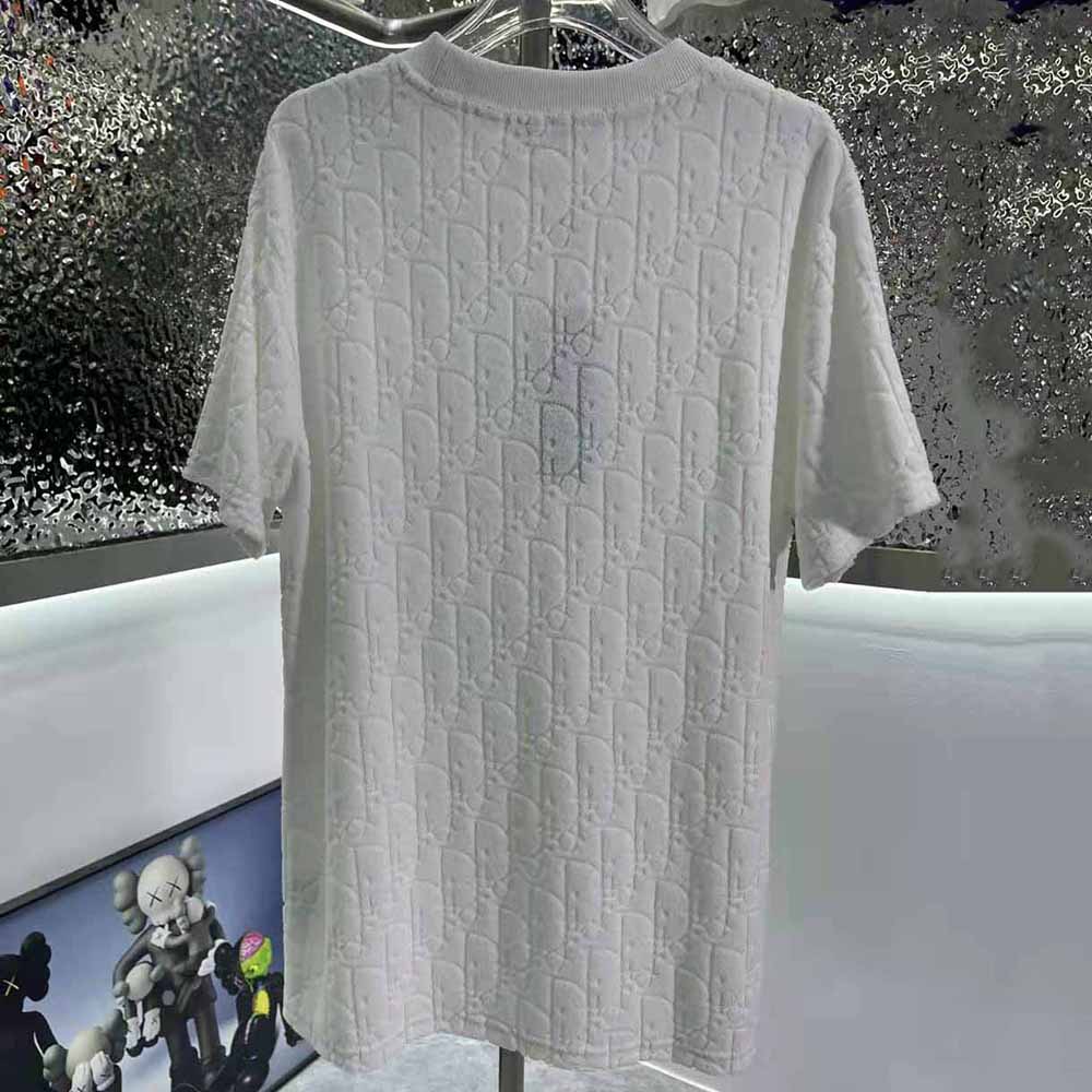 Side angle showing relaxed fit of Dior Men Oblique Off-White Terry Cotton T-shirt