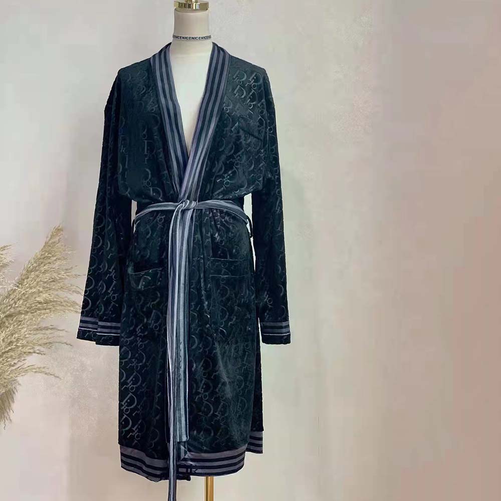 Close-up of Dior Oblique jacquard pattern on black bathrobe fabric