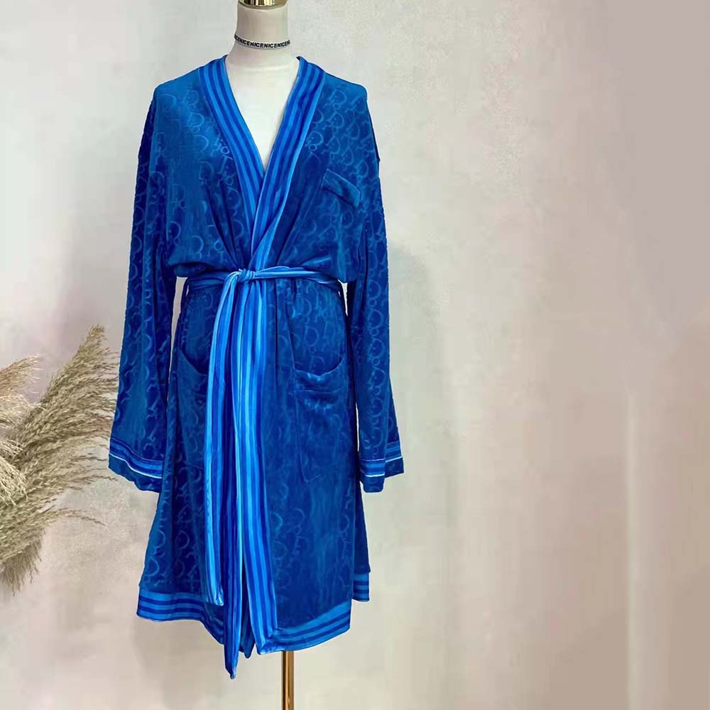 Close-up of Dior Oblique jacquard pattern on blue bathrobe fabric