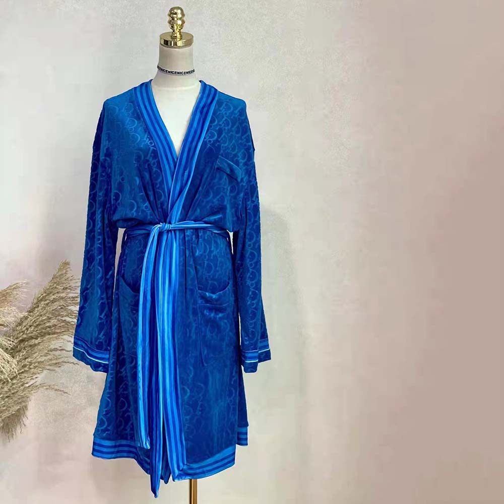 Side angle showcasing relaxed fit of Dior Men Unisize Oblique Bathrobe Blue