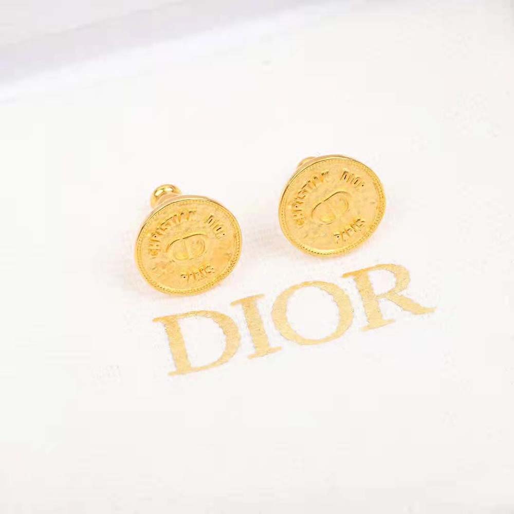 Side angle showing gold finish and post closure of Dior Women 30 Montaigne Earrings