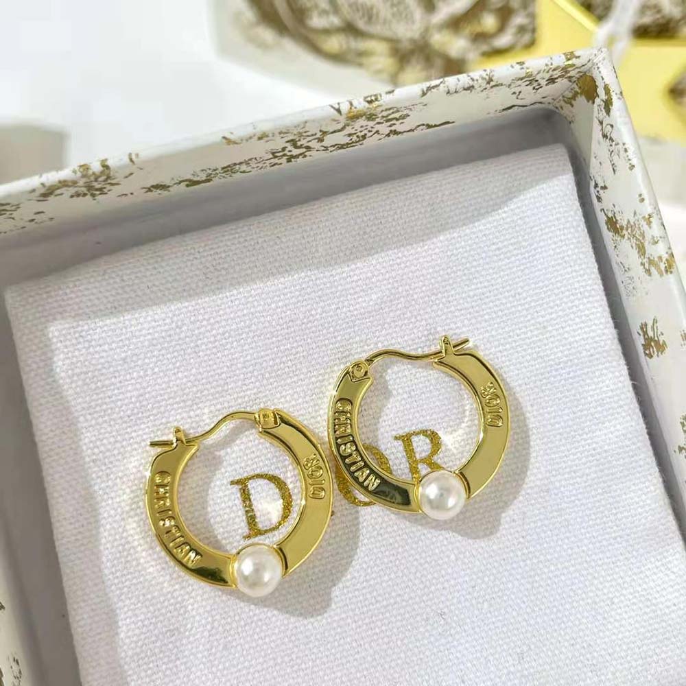 Close-up detail of Dior Women CD Navy Earrings ‘CD’ logo hardware