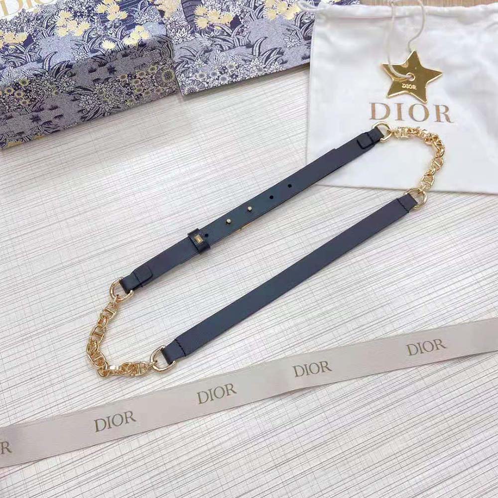 Close-up of shiny gold-finish metal buckle on Dior Women Caro Belt