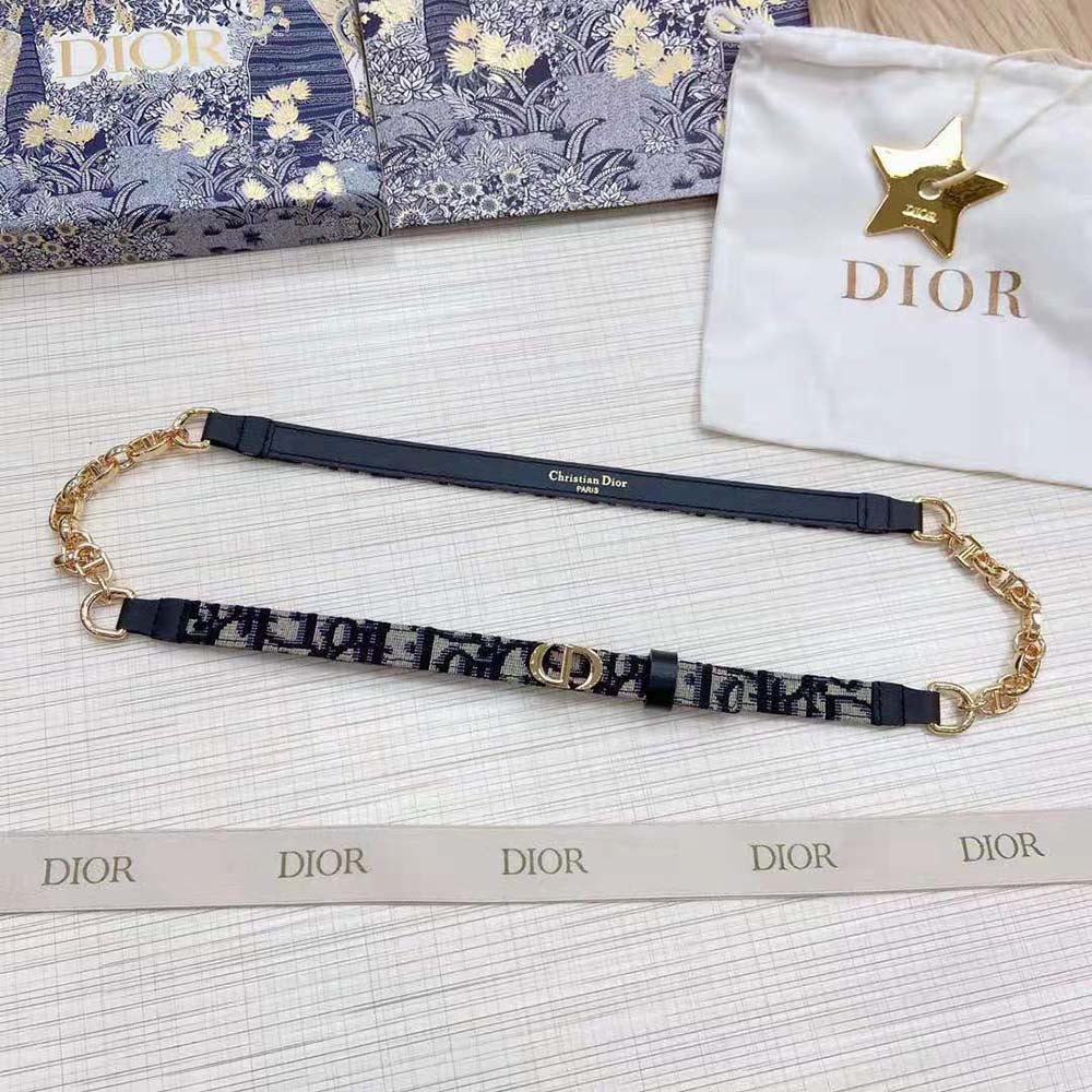 Close-up of shiny gold-finish metal buckle on Dior Women Caro Belt Blue