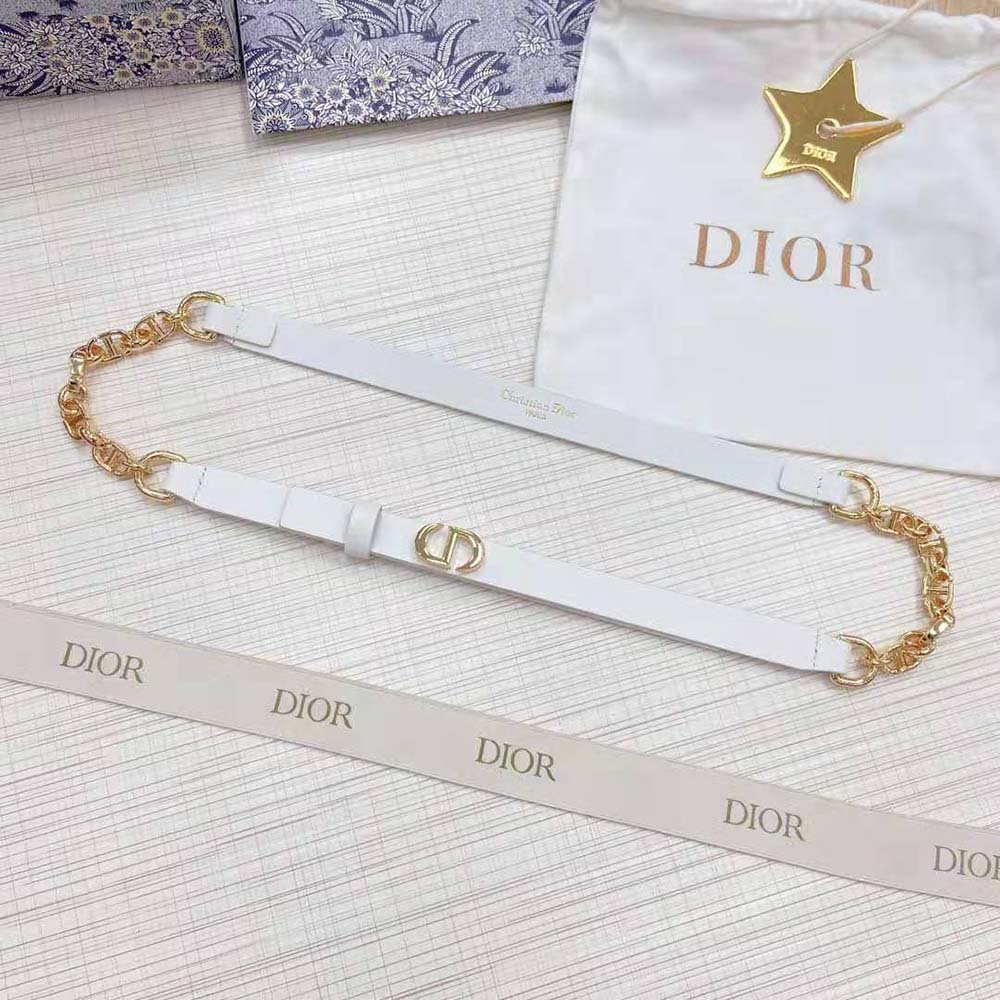 Close-up on shiny gold-finish buckle of Dior Women Caro Belt White