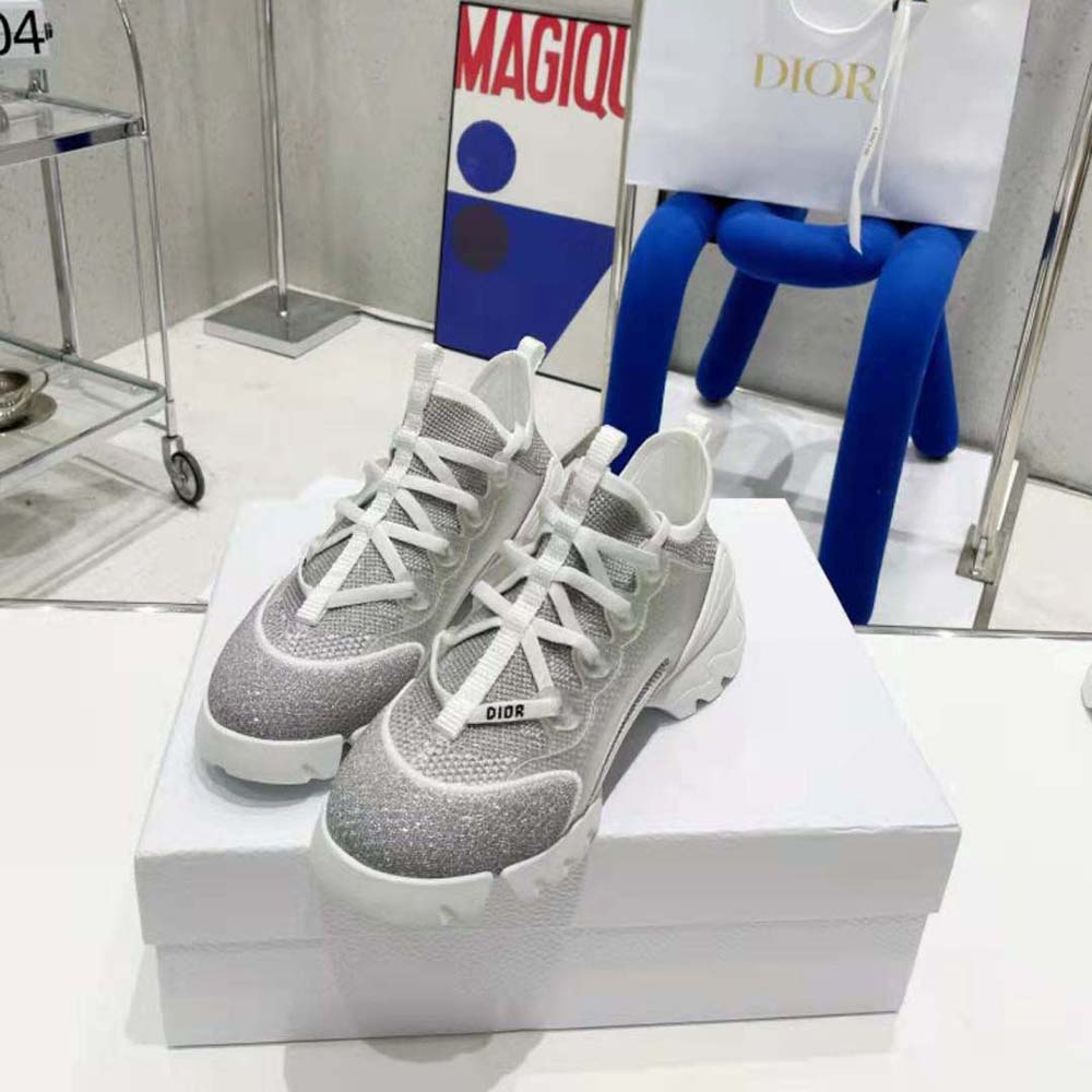 Angled shot highlighting Dior logo hardware on D-Connect Sneaker
