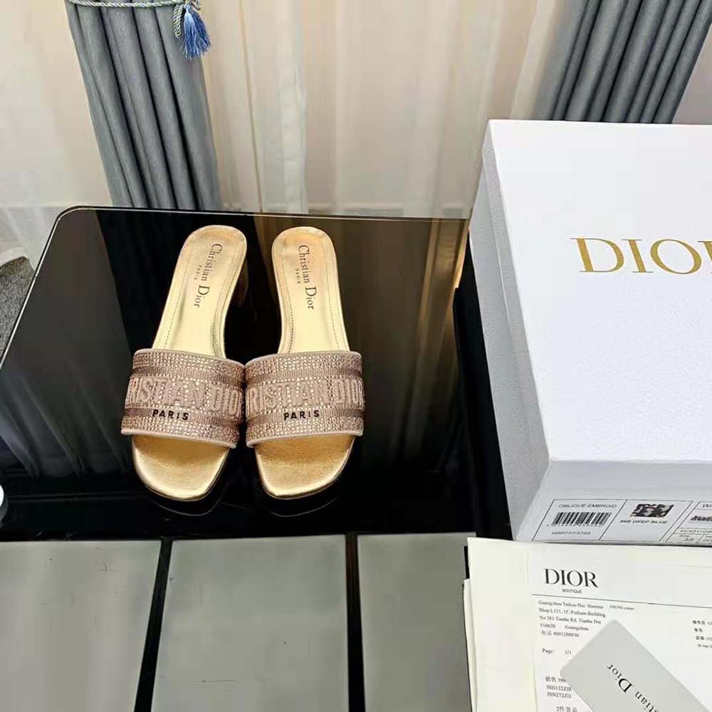 Close-up on gold-tone buckle of Dior Women Dway Heeled Slide