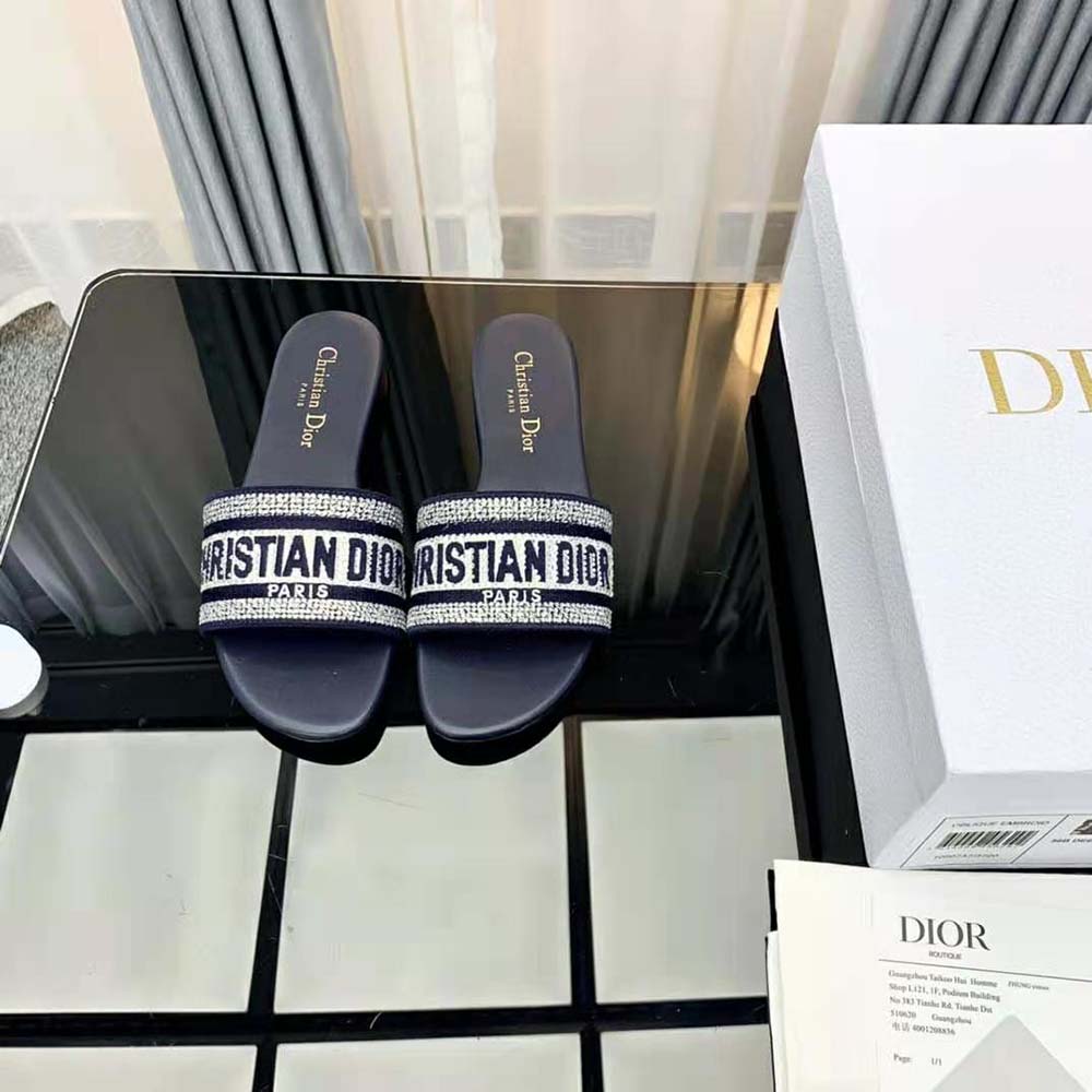 Close-up of silver-tone strass and metallic thread details on Dior slide