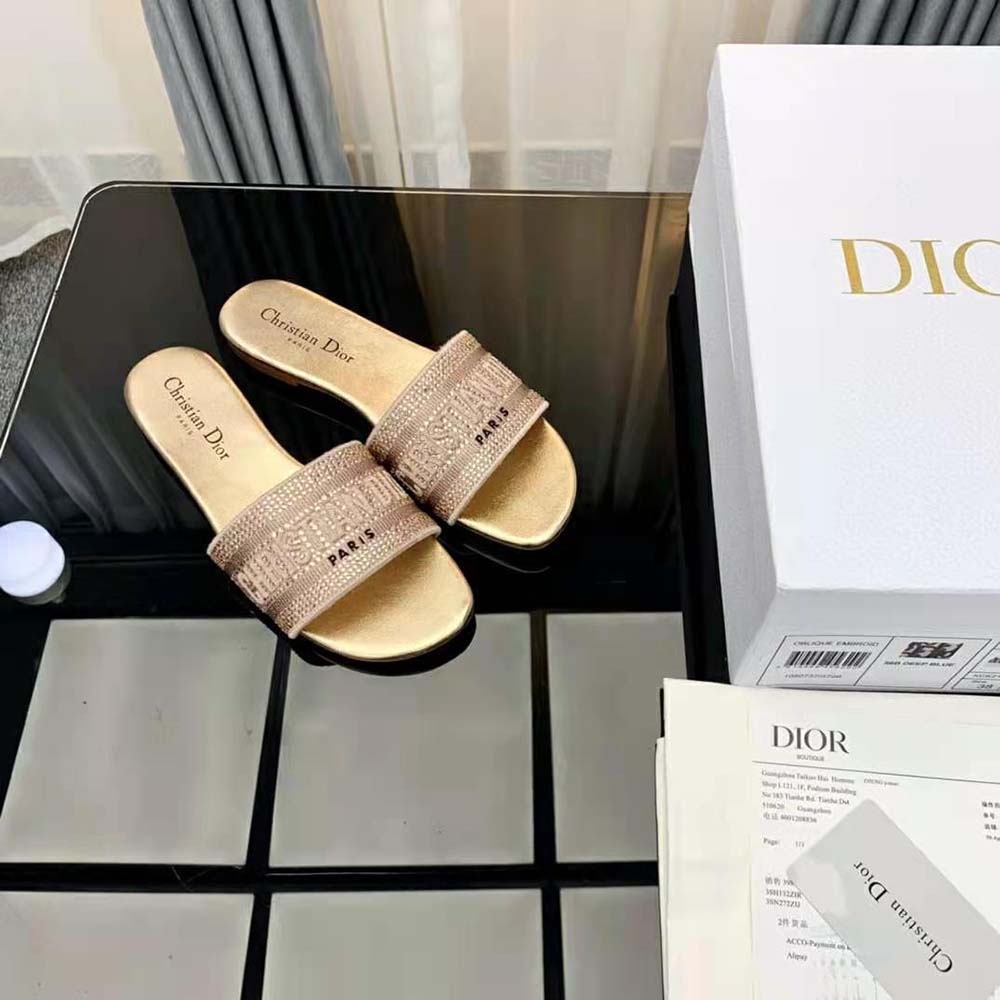 Side view showcasing silhouette of Dior Women Dway Slide Gold-Tone sandal