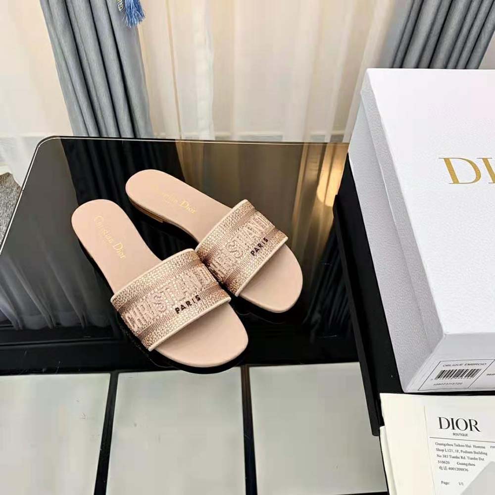 Top view showing slide silhouette and pink embroidered cotton material