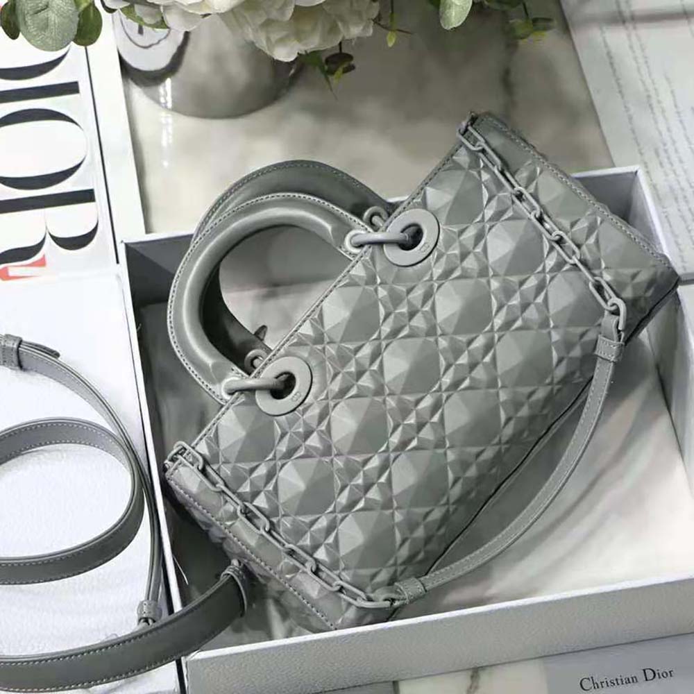 Side angle showcasing silver-tone clasp on Dior Women Lady D-Joy Bag