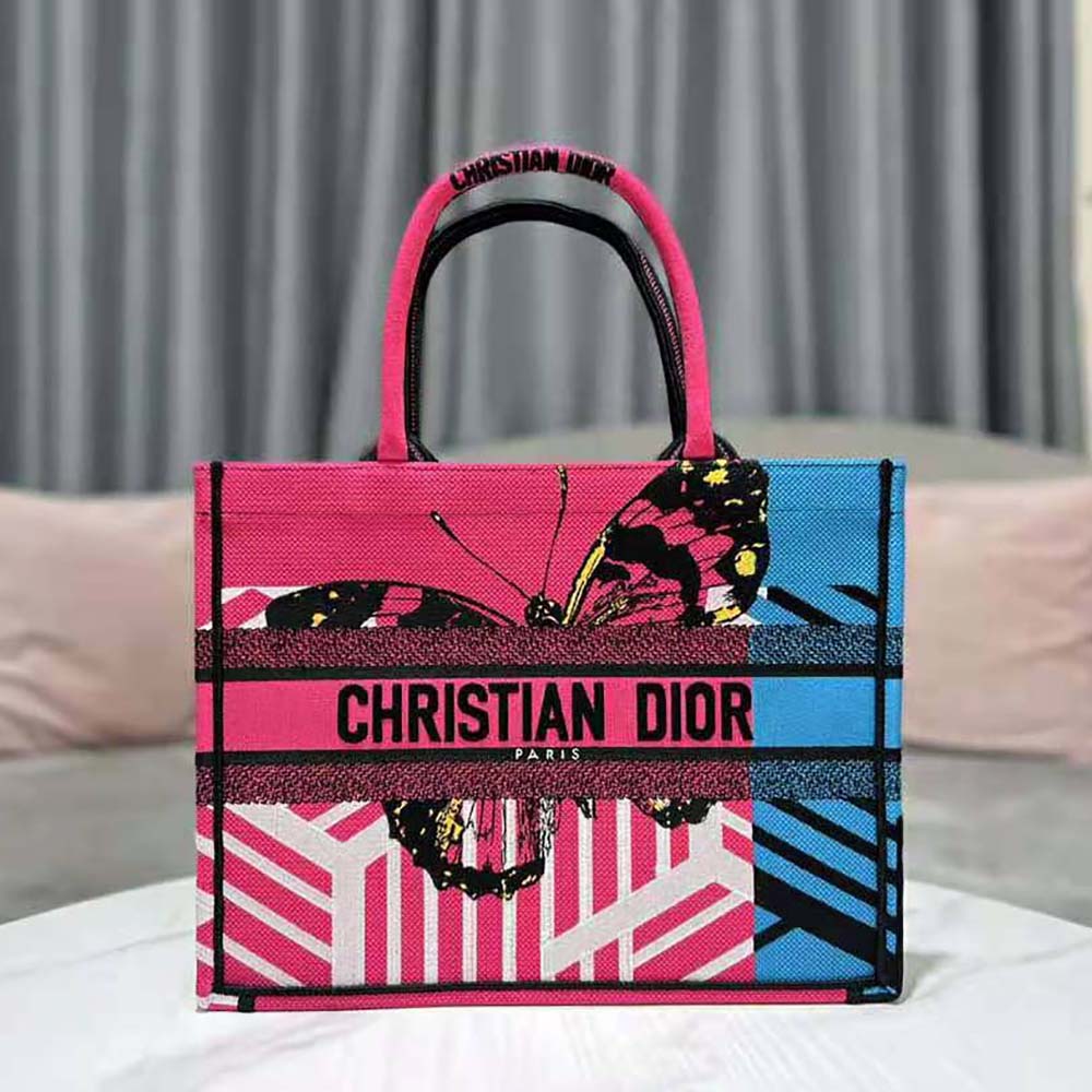 Close-up of bright pink and blue embroidery on Dior Women Medium Dior Book Tote