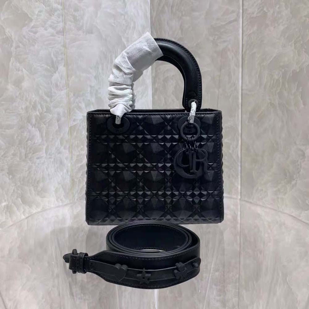 Close-up of diamond motif and silver hardware on Dior Women Mini Lady Dior Bag