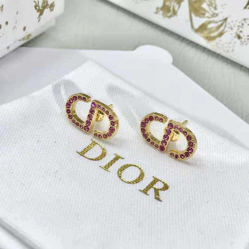 Side profile showing gold-finish metal and secure closure of Dior Women Petit CD Stud Earrings