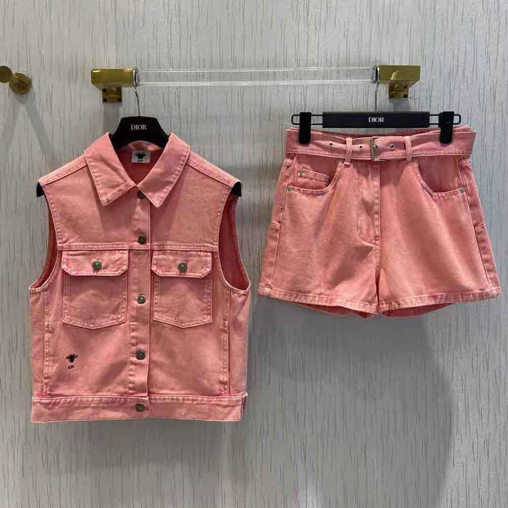 Close-up of silver Dior hardware on pink cotton denim shorts