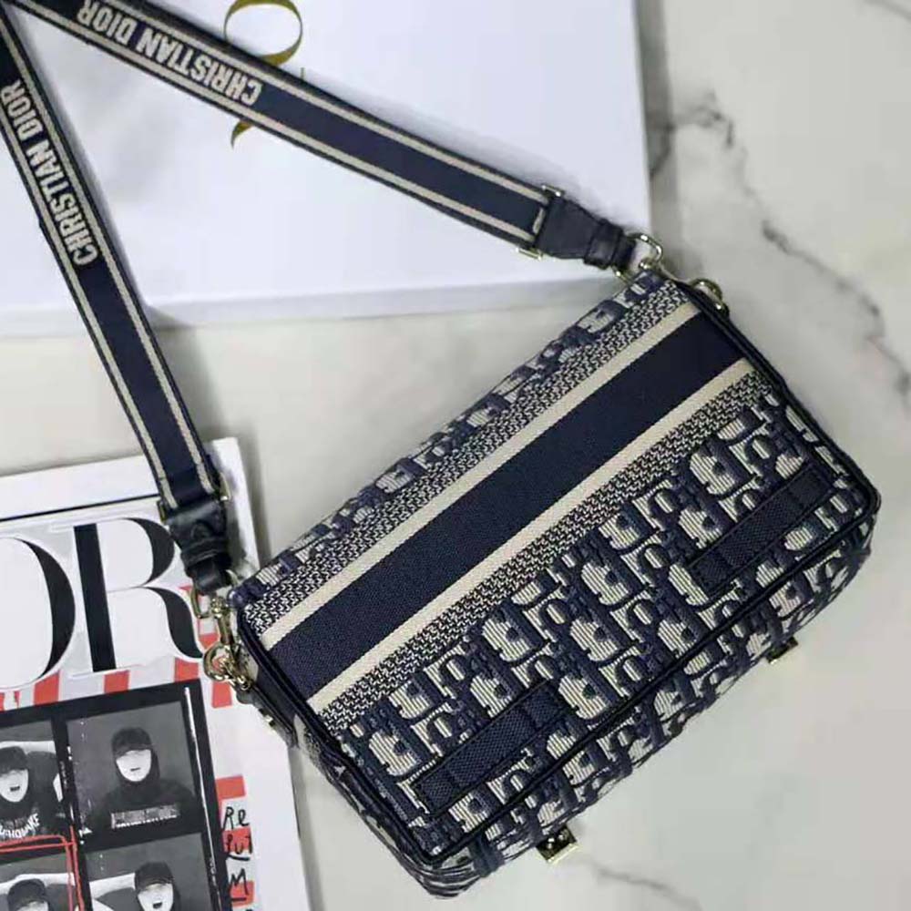 Side angle showing silver-tone hardware on Dior Women Small Diorcamp Bag