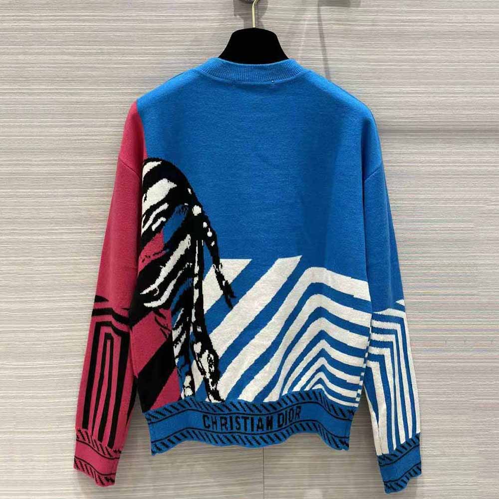 Side profile showing relaxed fit and ribbed edges of Dior Women Sweater bright blue and pink