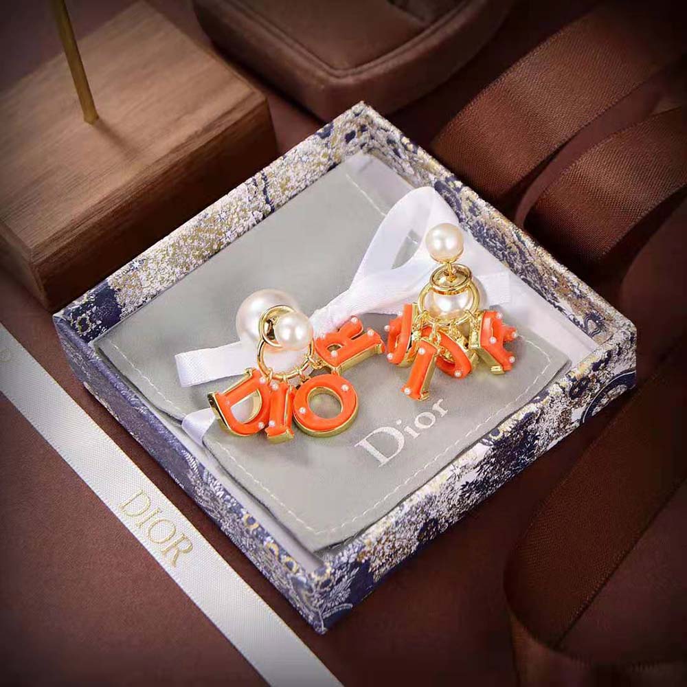 Side angle showing orange accent on Dior Women Tribales Earring