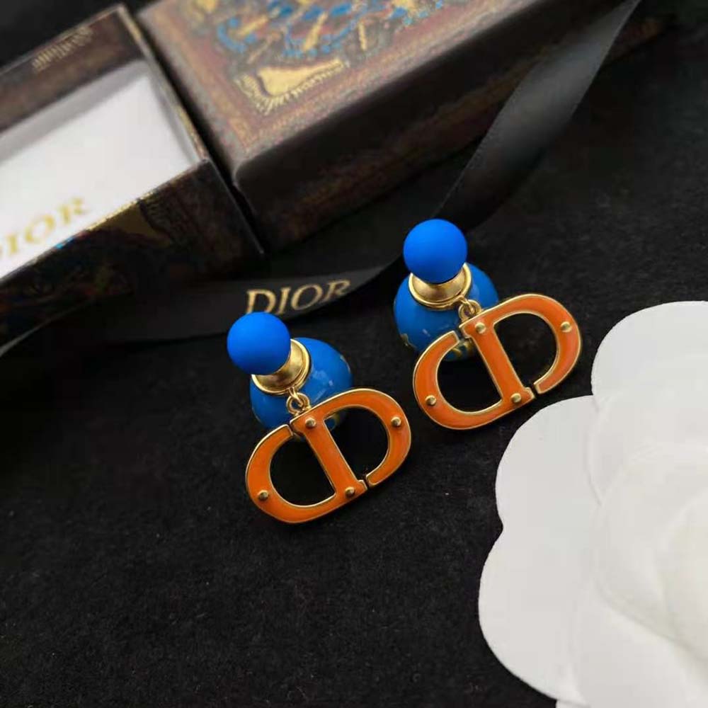 Close-up detail of fluorescent blue lacquer on Dior Women Tribales Earring