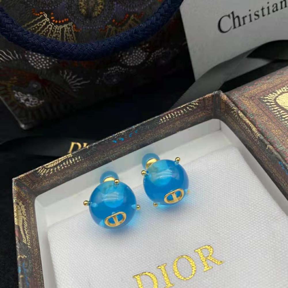 Close-up detail of blue transparent resin pearls on Dior Women Tribales Earrings