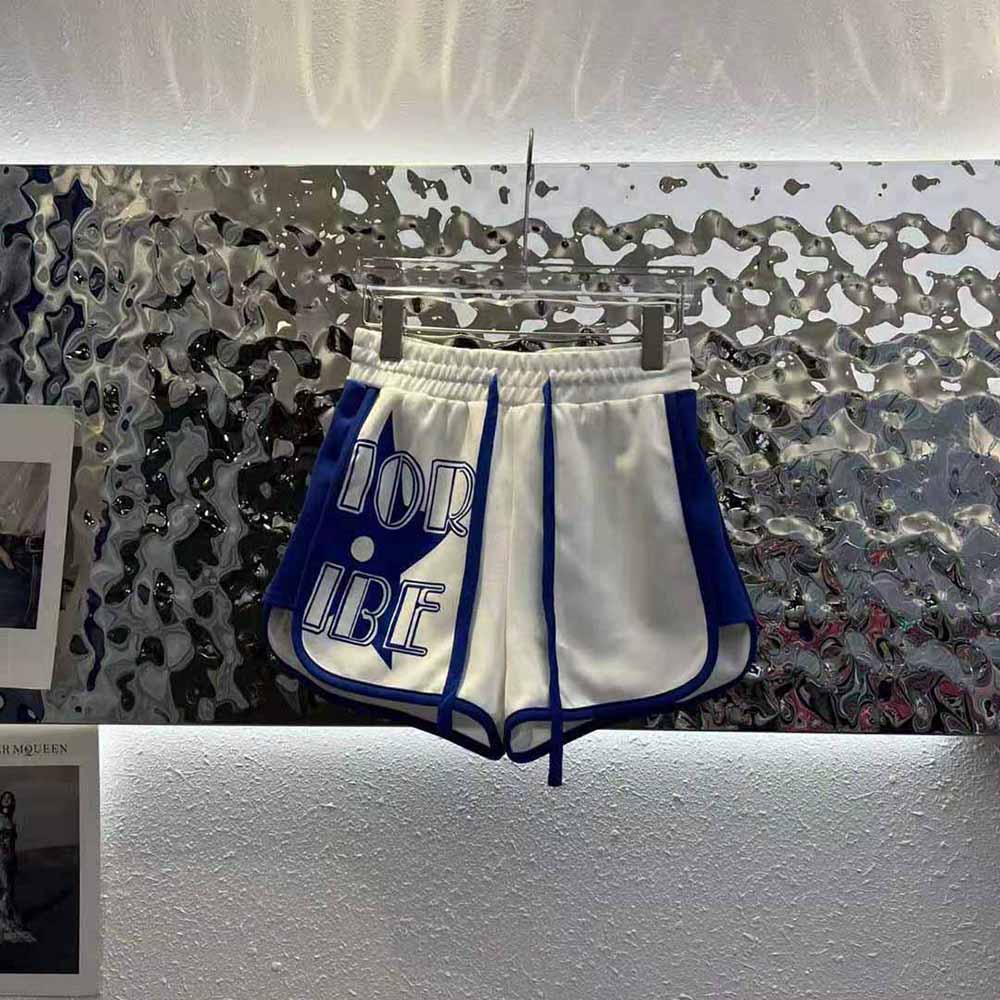 Close-up of jacquard pattern and Dior logo on shorts waistband