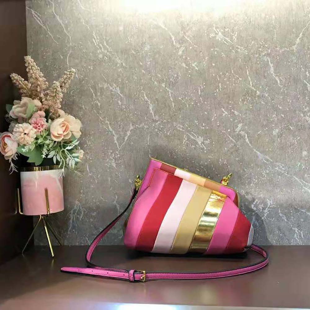 Side angle showing gold hardware on Fendi Women Fendi First Small Leather Bag