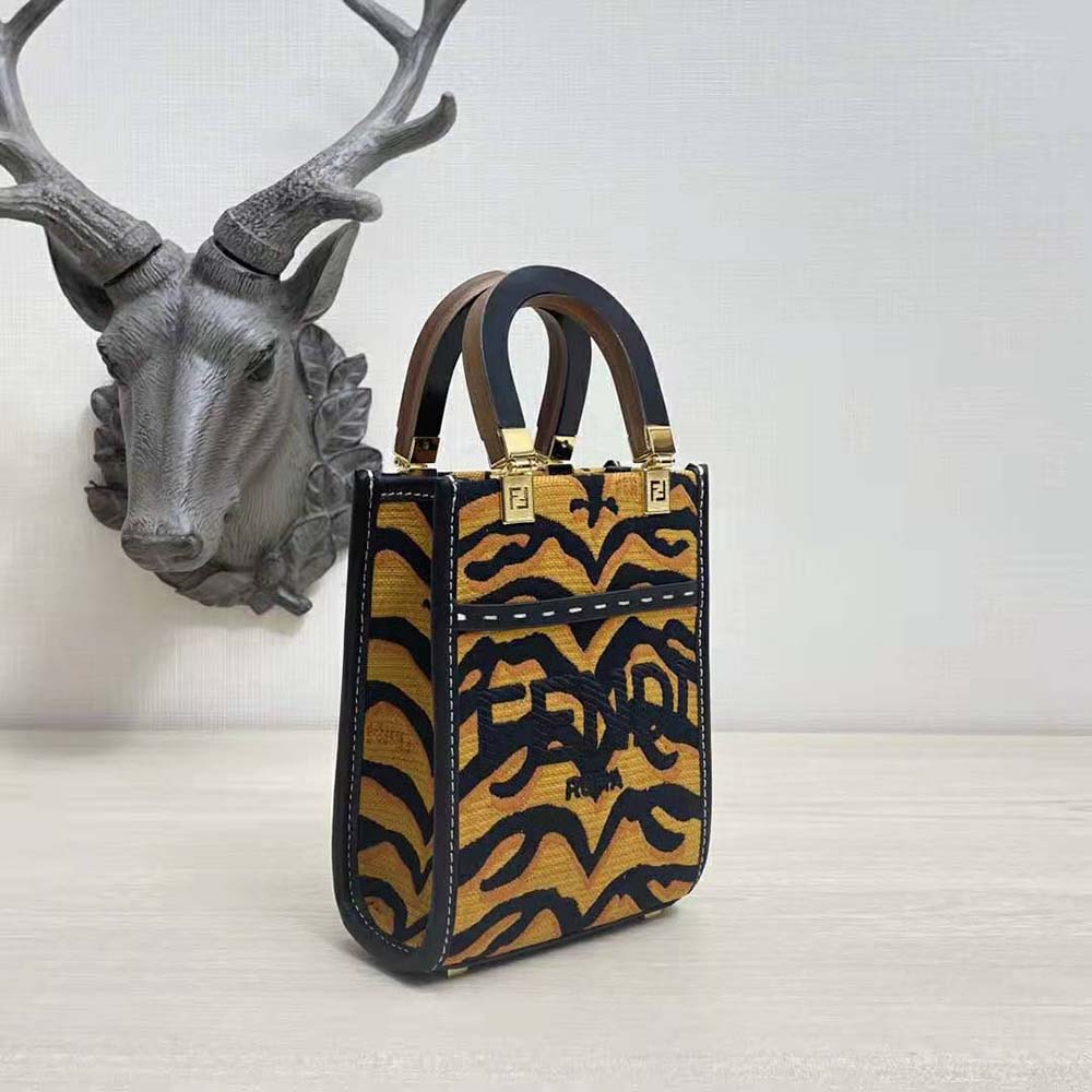 Side angle showing structured silhouette of Fendi Women Mini Sunshine Shopper