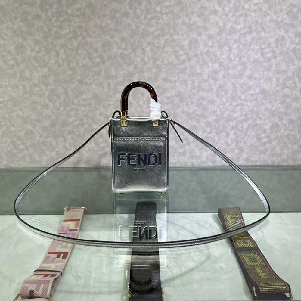 Close-up of silver laminated leather texture on Fendi Mini Sunshine Shopper