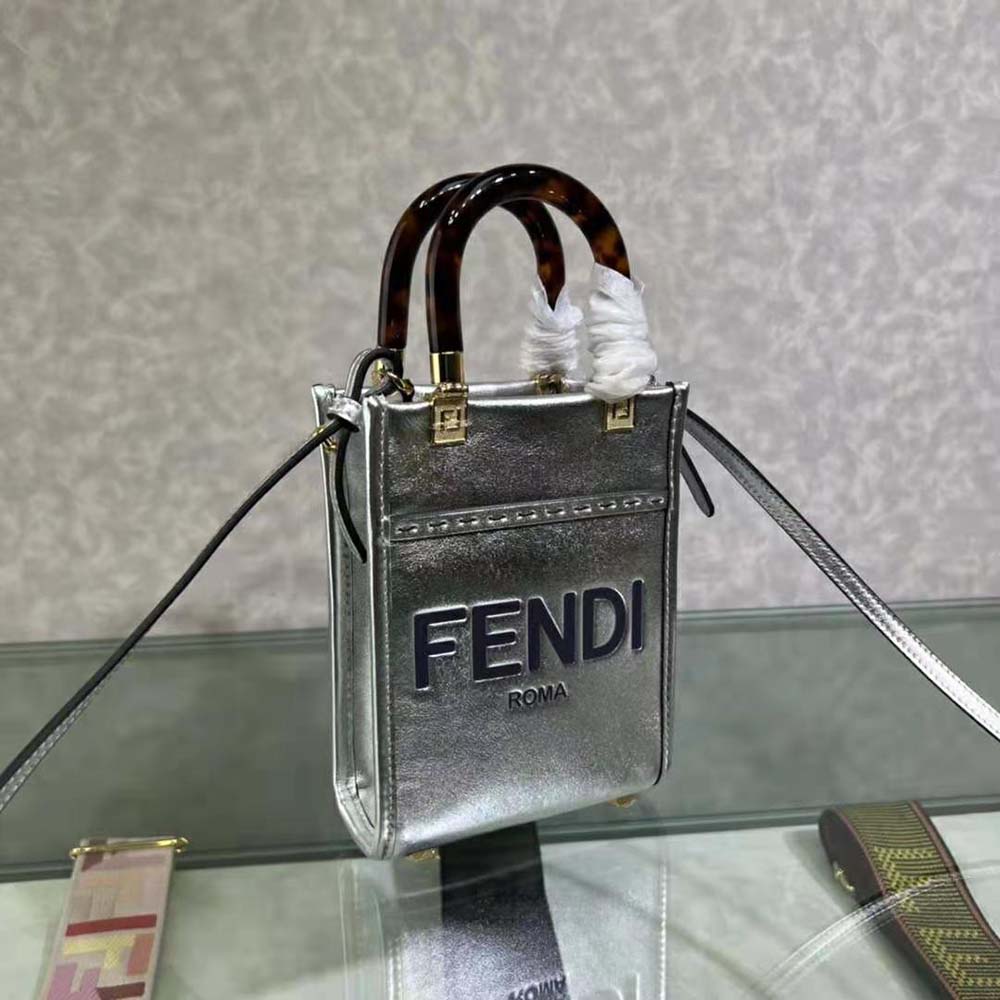 Side profile showing silver hardware on Fendi Women Mini Sunshine Shopper