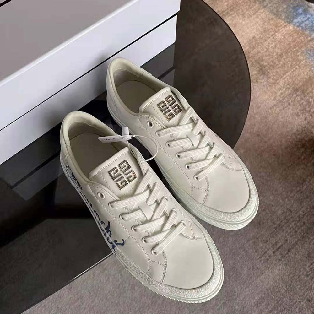 Close-up of GIVENCHY print detail on white leather sneaker