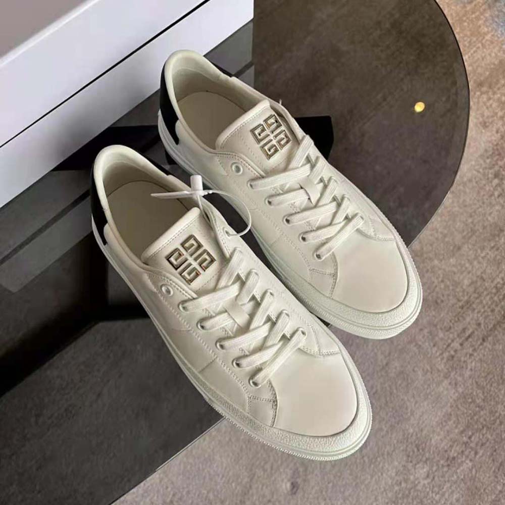 Close-up of embossed Givenchy logo on City Sport sneakers white leather