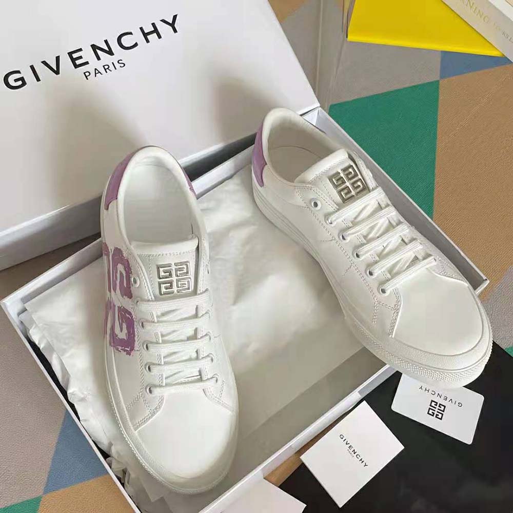 Close-up of 4G logo embossed detail on purple leather sneaker