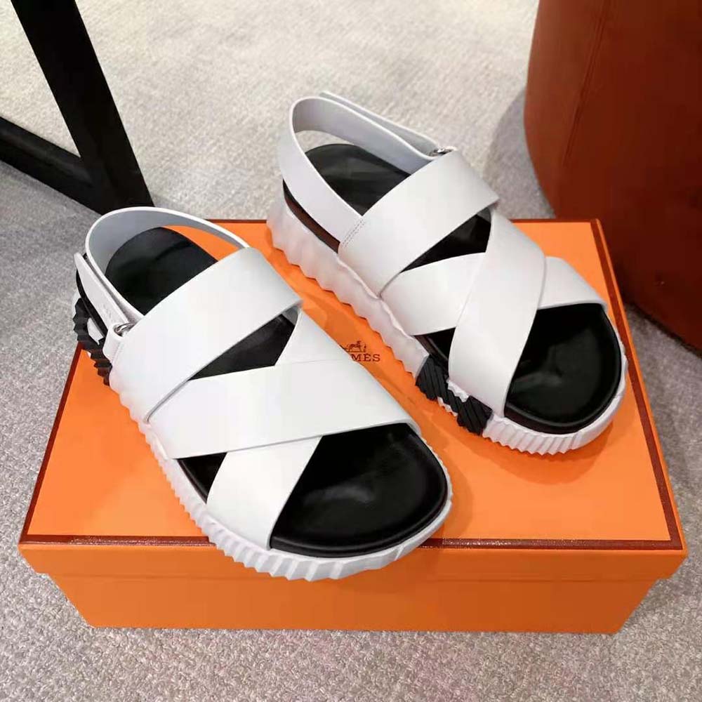 Close-up detail of white calfskin and Hermes ‘H’ cutout on Electric Sandal