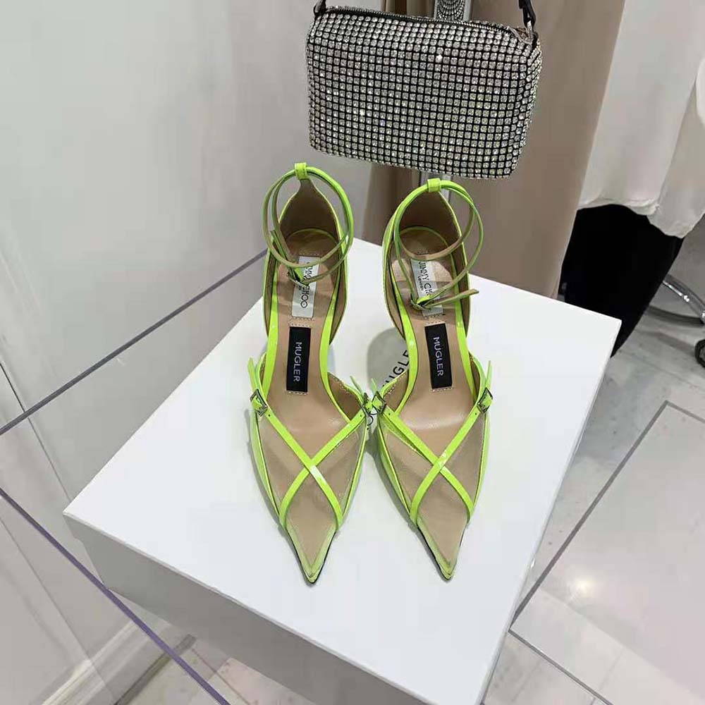Close-up on neon yellow patent leather and mesh texture in Jimmy Choo Mugler pumps