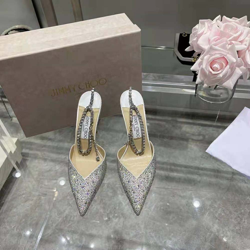 Close-up detail of crystal embellishment on Jimmy Choo Saeda 100 Ivory Satin Pumps
