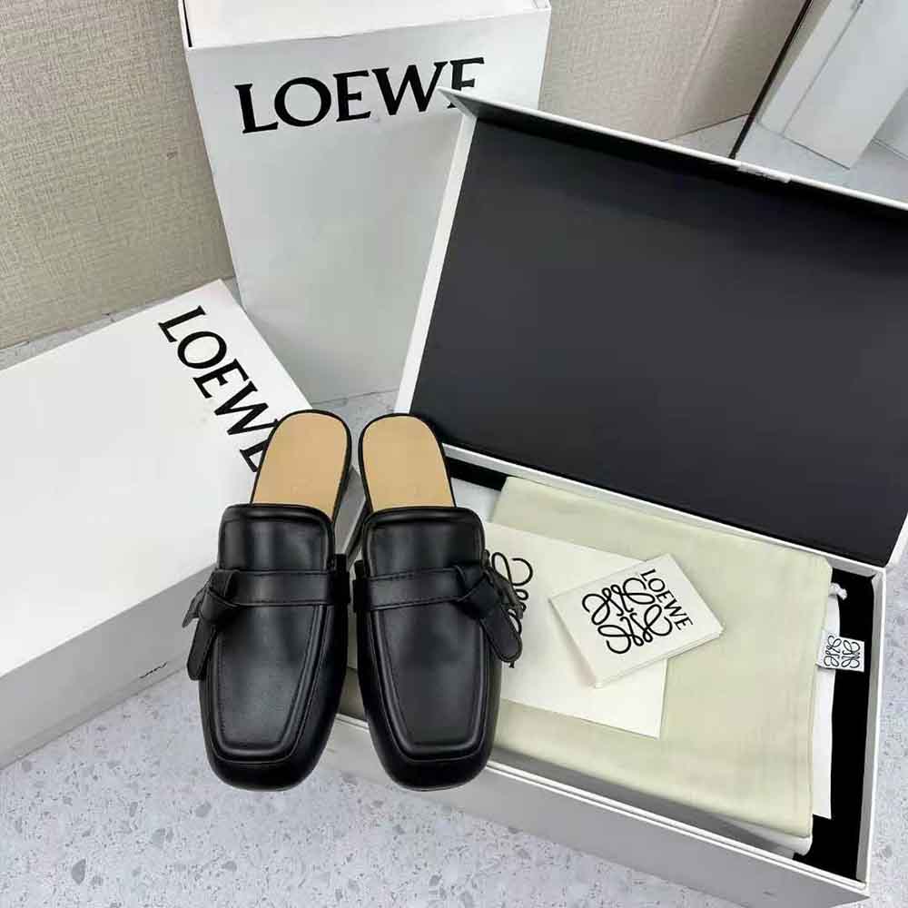 Side profile showcasing flat silhouette of Loewe Women Gate Flat Mule