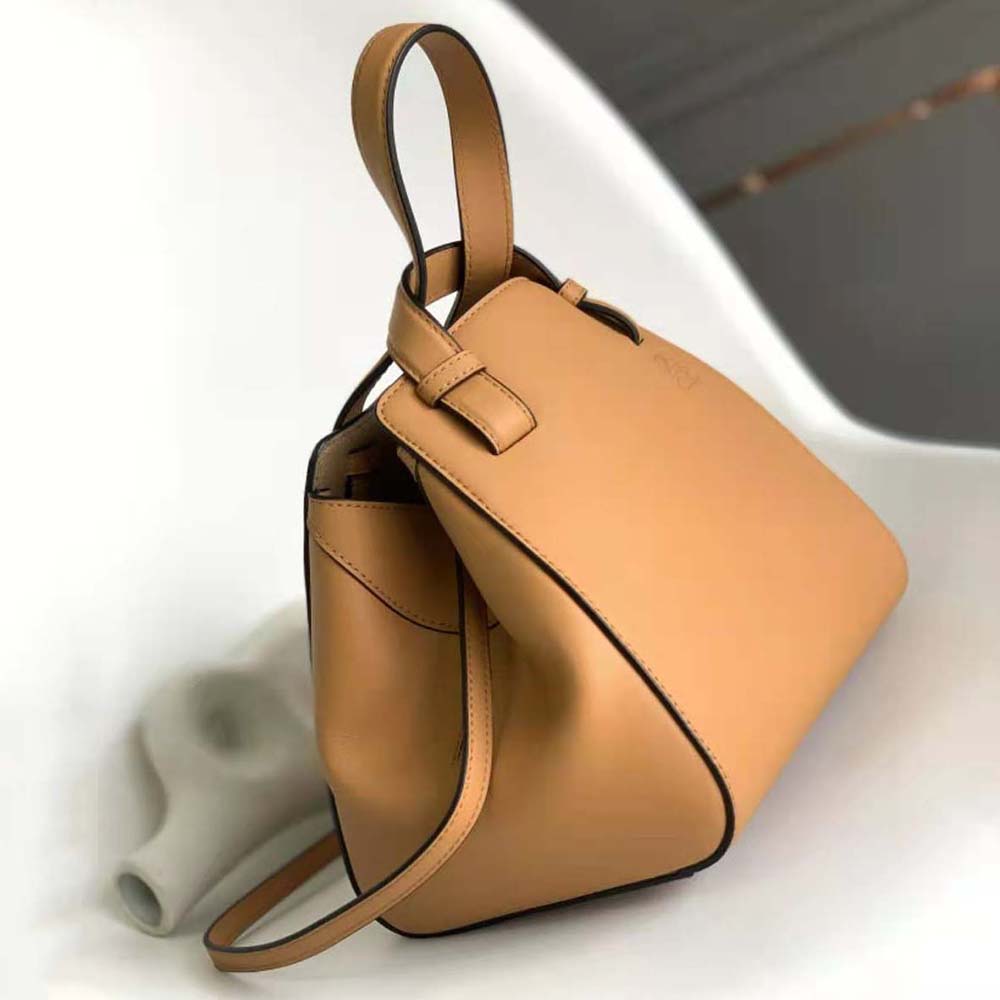 Side profile showing flexible silhouette of Loewe Women Hammock Nugget Bag