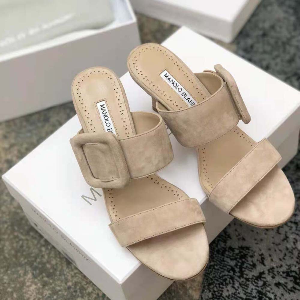 Close-up on open toe detail and soft suede of Manolo Blahnik mules