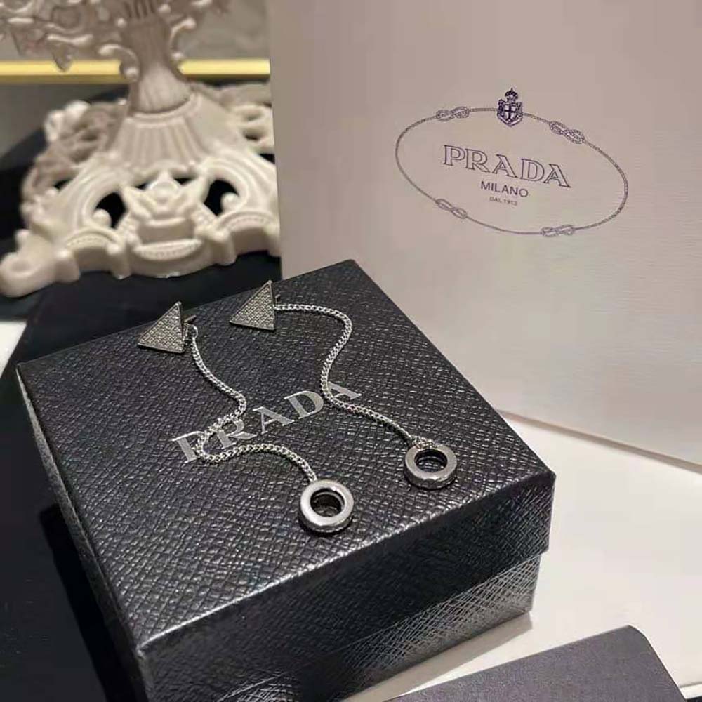 Side angle showing pendant silhouette of Prada Women Crystal Logo Jewels AirPods Pendant Earrings