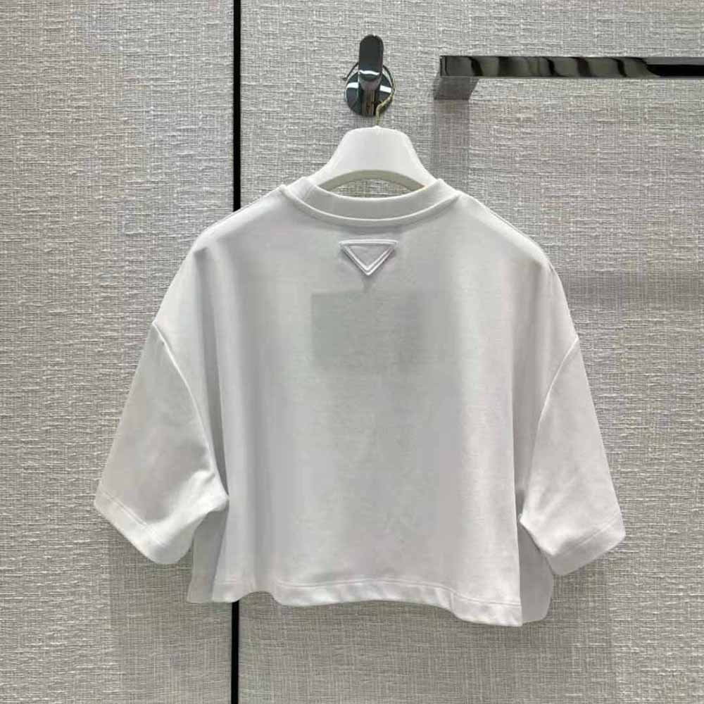 Side angle showing silhouette of Prada Women Embroidered Interlock Crop T-shirt-White