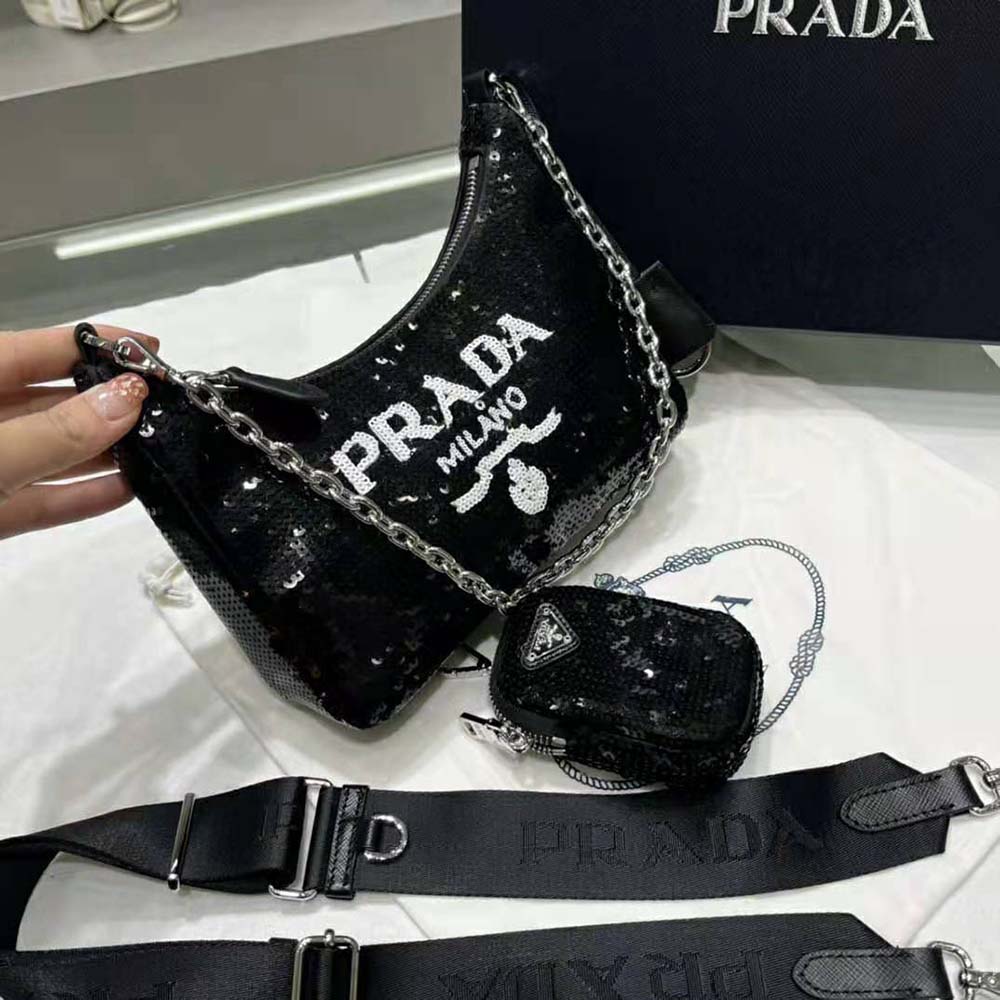 Side angle showing slim silhouette of Prada Women Re-Edition mini-bag