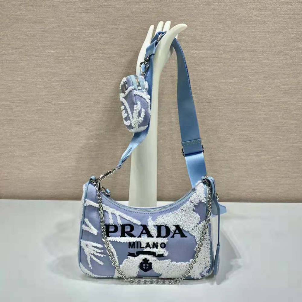 Close-up of blue embroidery detail on Prada Re-Edition 2006 shoulder bag