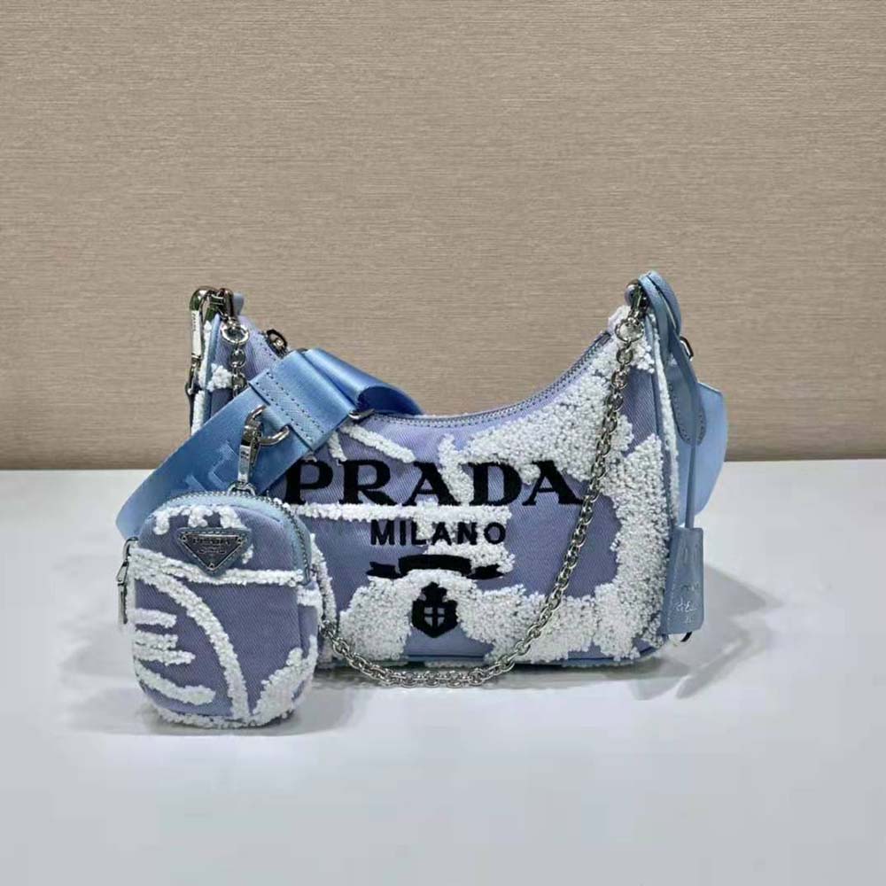Side profile showing silver-tone hardware on Prada Re-Edition 2006 bag