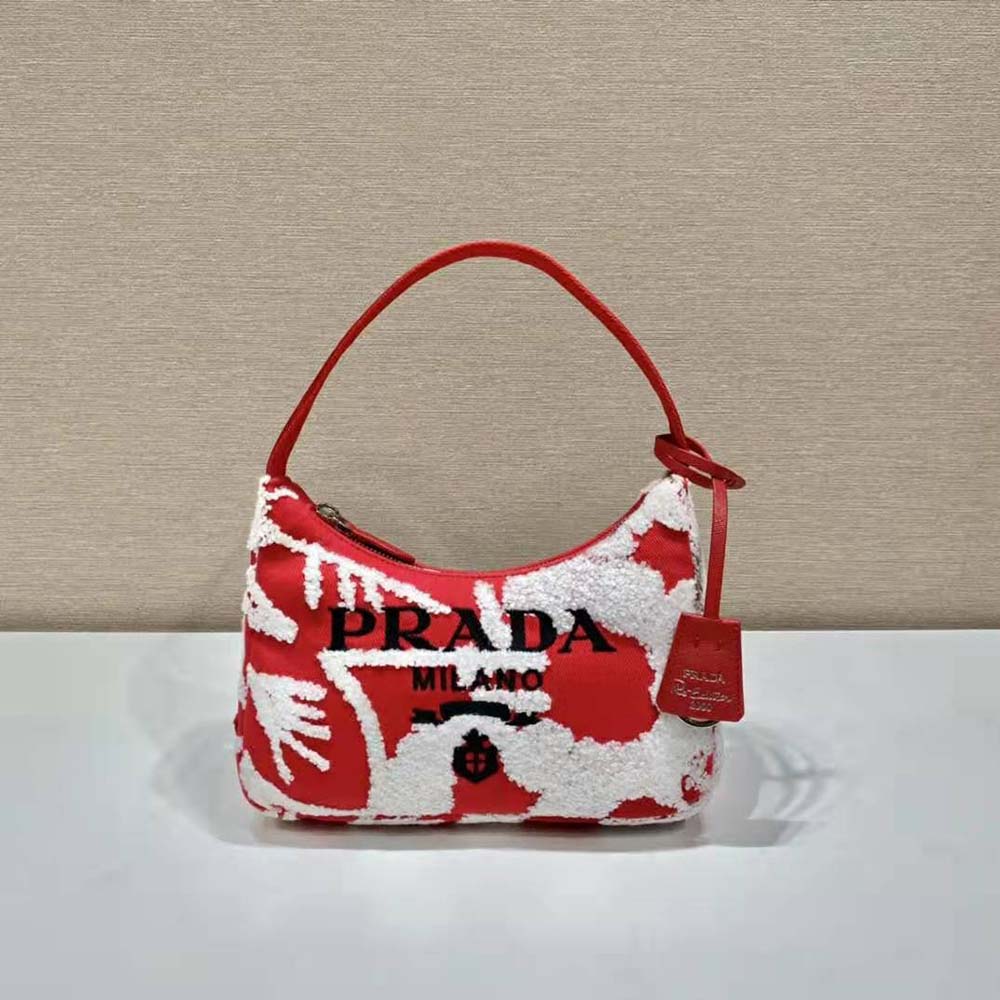 Close-up on silver hardware and detailed embroidery, Prada mini bag red