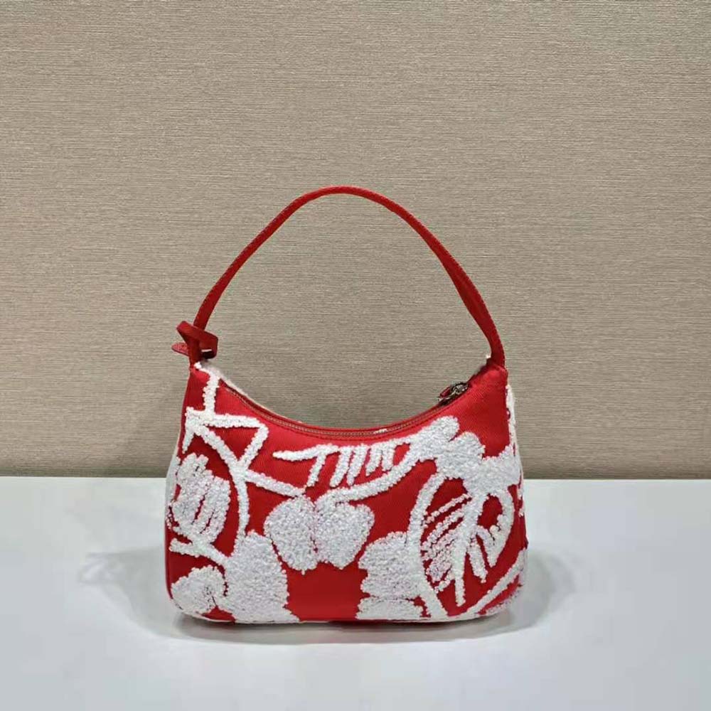 Side angle showing compact silhouette of Prada Women Re-Edition 2006 Mini Bag