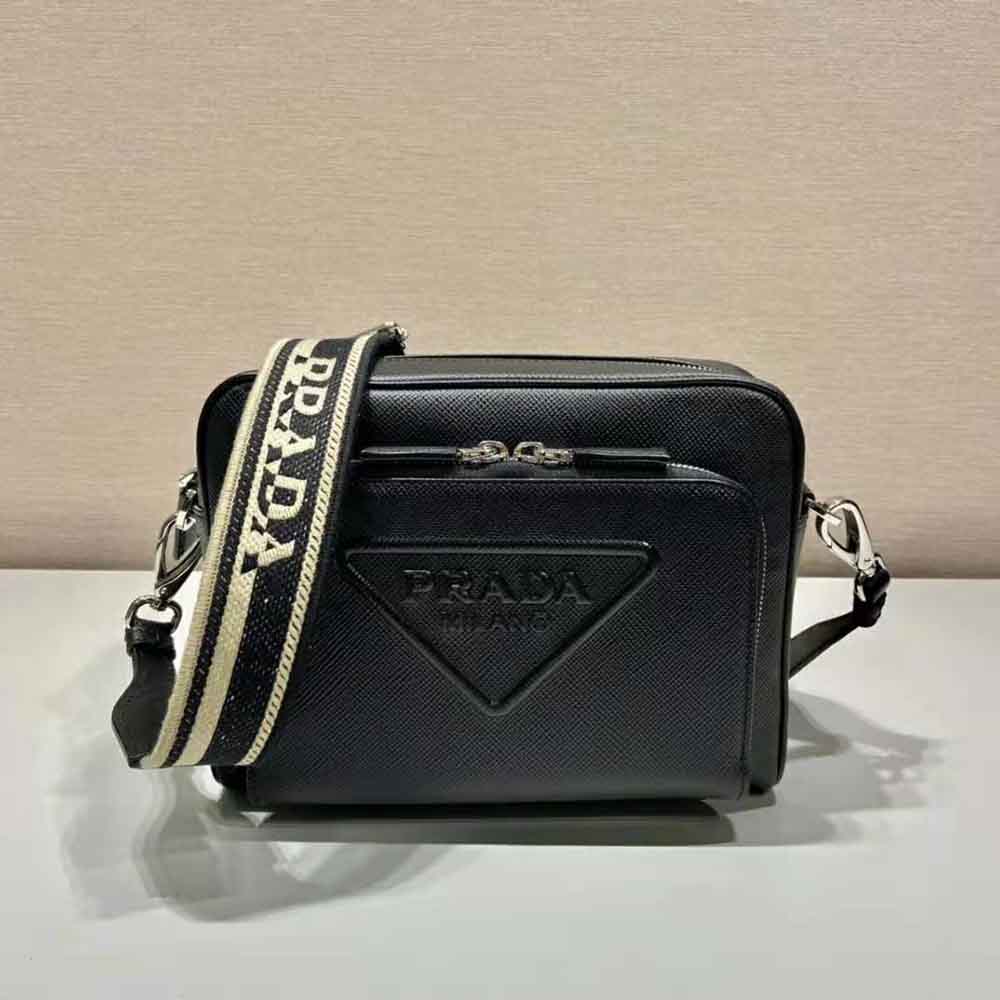 Close-up detailing Prada logo and Saffiano leather texture on shoulder bag