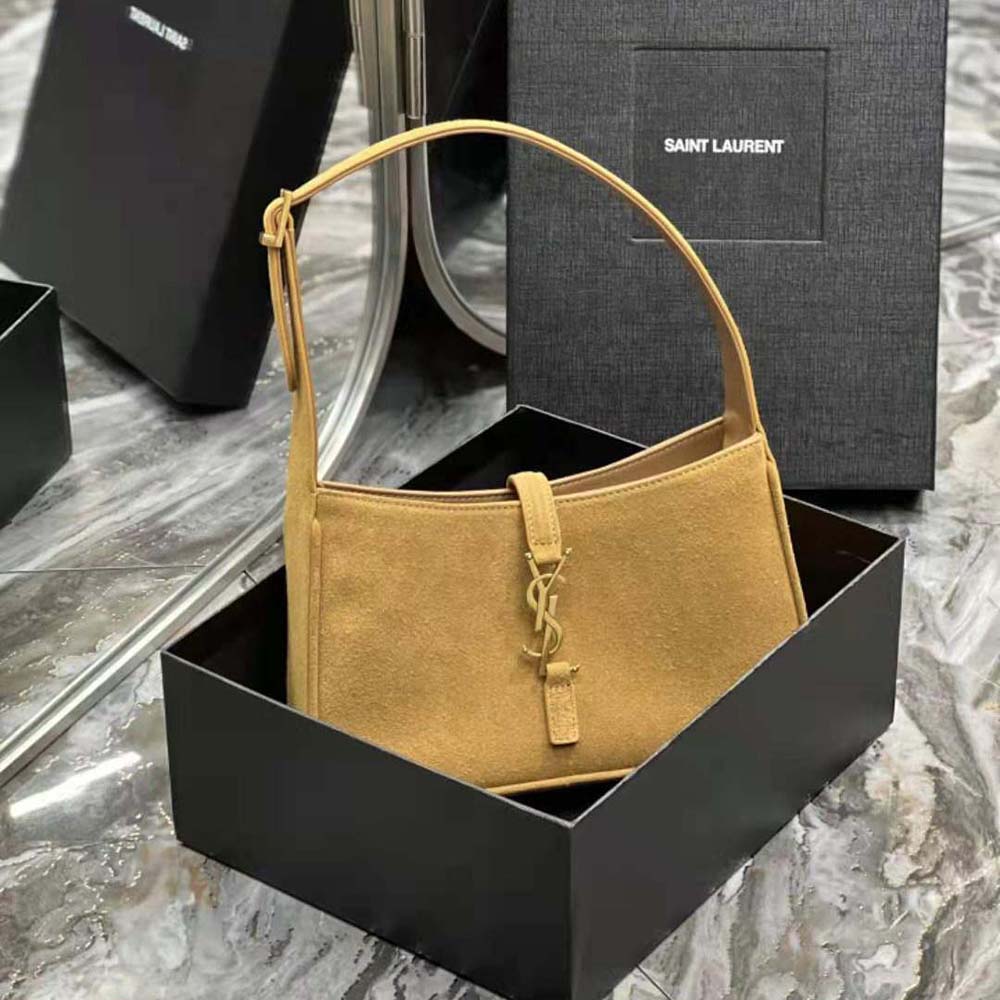 Close-up of gold YSL logo hardware on Saint Laurent YSL Le 5 A 7 Hobo Bag