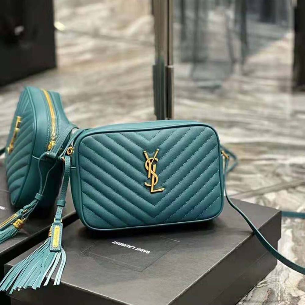 Close-up of gold YSL logo hardware on Lou Camera Bag dark green