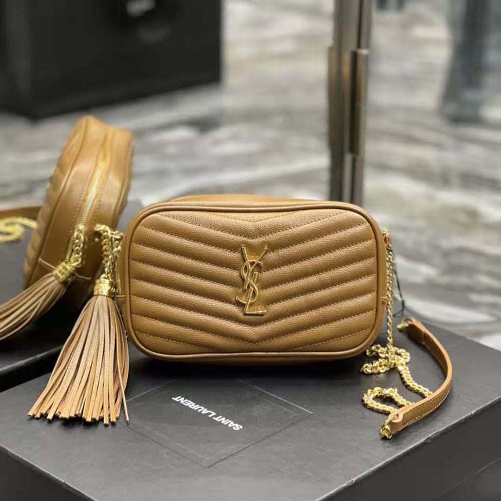 Close-up of YSL gold hardware and embossed leather texture on mini bag